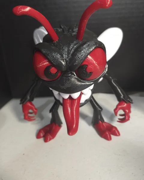 Red and black fly creature with fangs and a long tongue