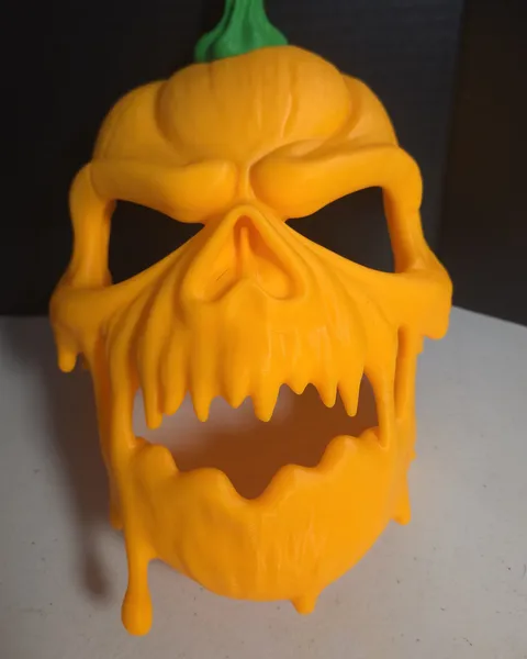 Orange pumpkin skull mask with a dripping jaw